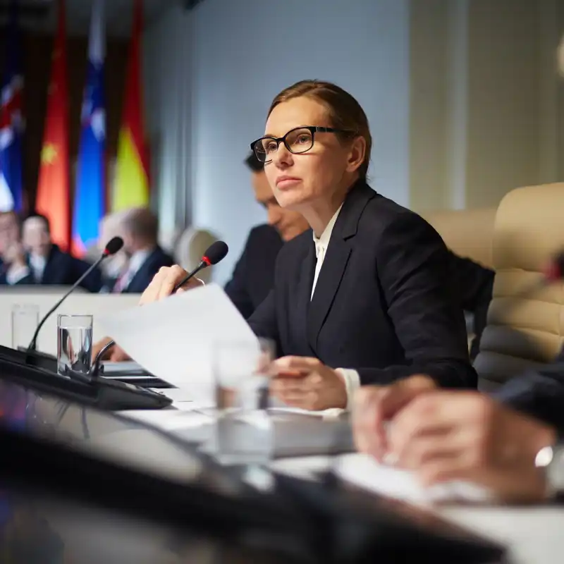 Female politician at a hearing.