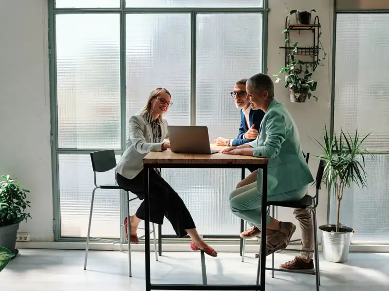 A financial advisor meeting with clients.