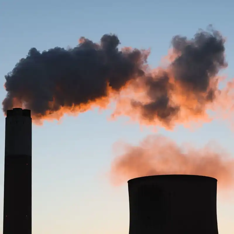 Vapor rises from cooling towers.