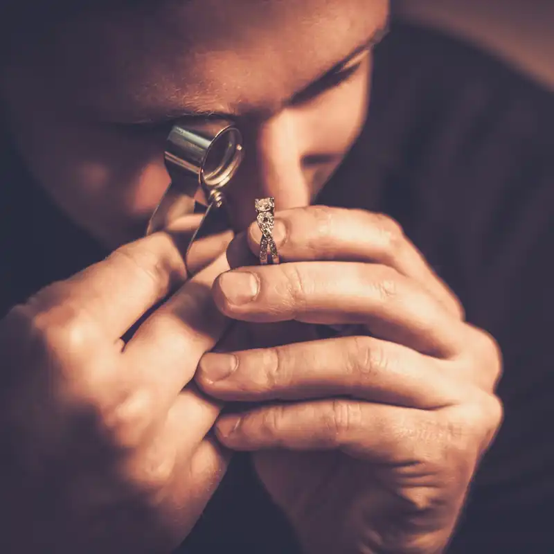 Portrait of a jeweler during the evaluation of jewels.