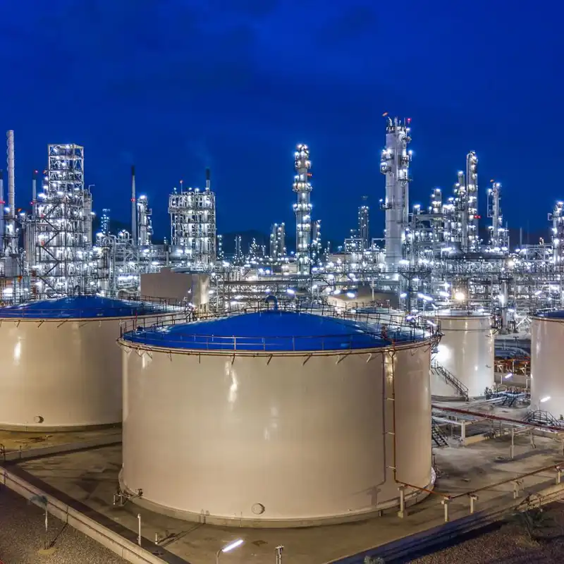 Aerial view oil storage tank with oil refinery background.