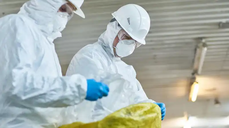 construction workers in hazmat suits