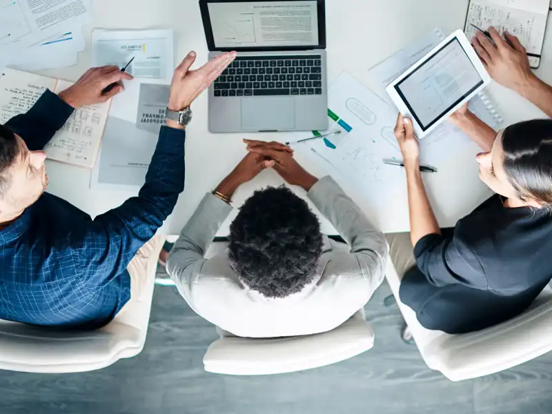 aerial view of three business people working
