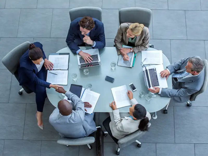 Overhead view of professionals at a meeting.