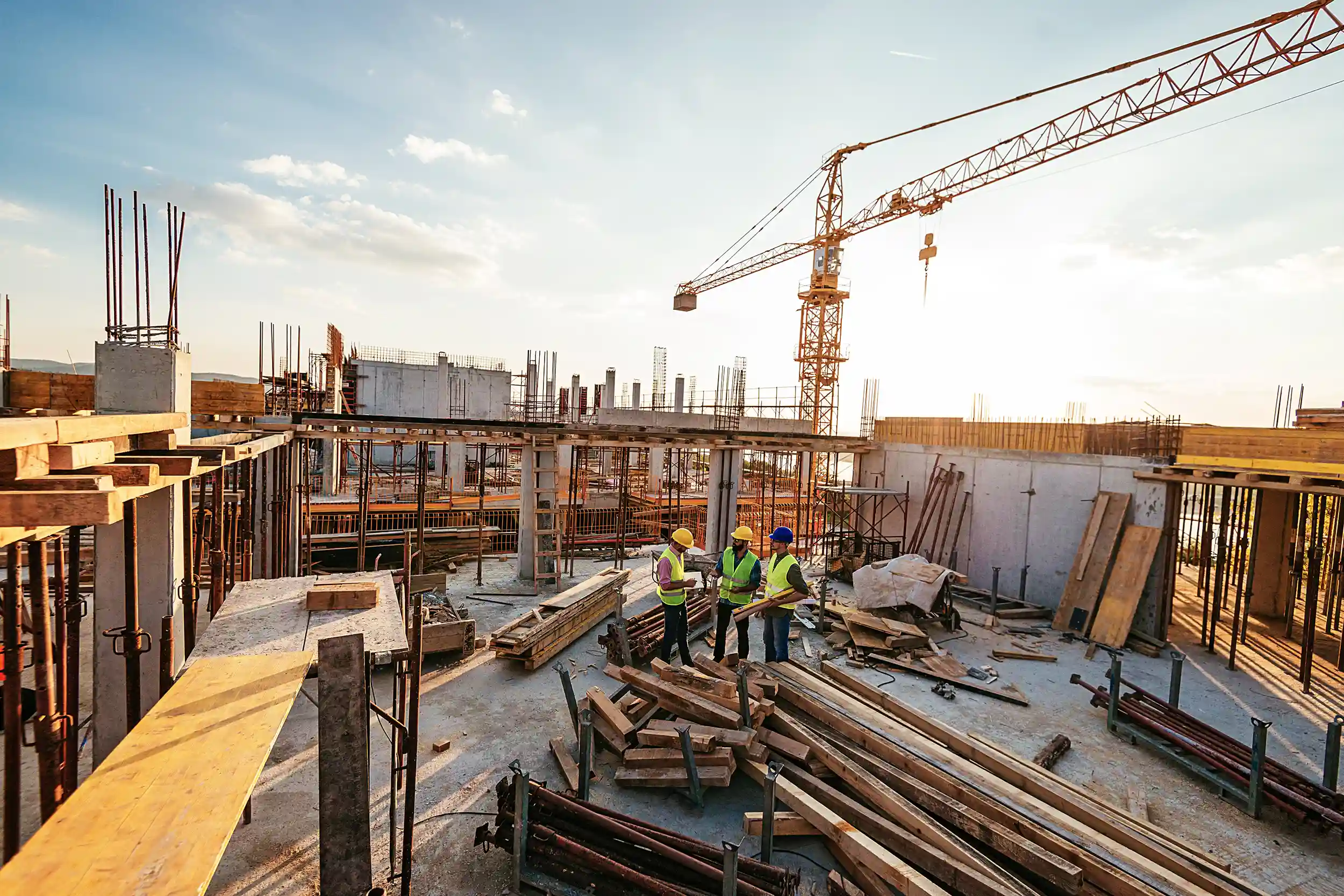 Construction workers talking on a job site
