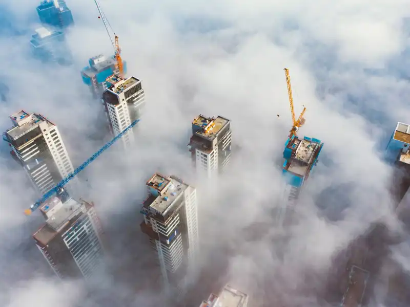 View over a cloudy city from the sky.