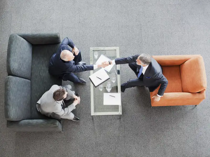 A bird's eye view of businessmen shaking hands