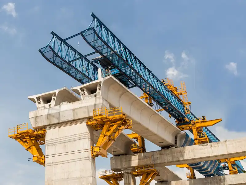 View from the ground of a bridge under construction.