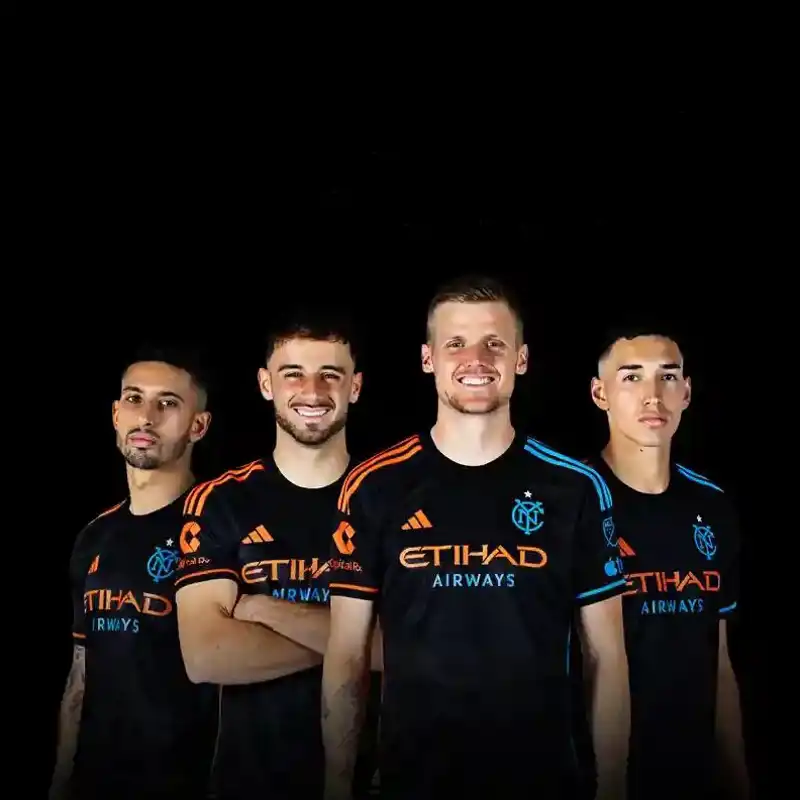 NYCFC players posing with a black background.