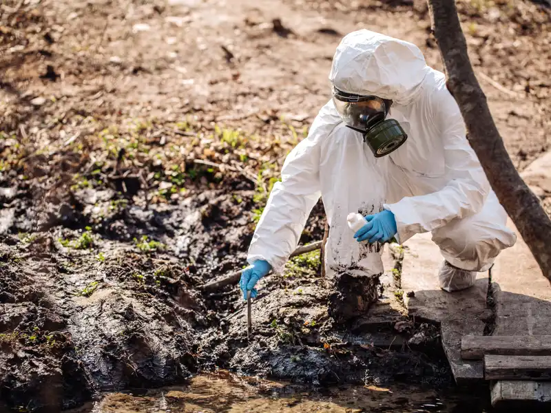 Woman collects soil in a test tube. soil analysis, environment, ecology concept.