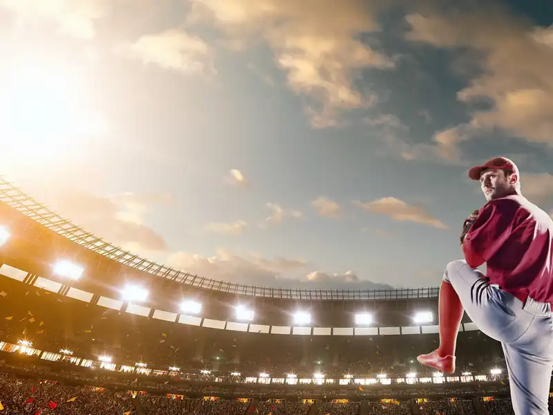 Pitcher on the mound in a baseball stadium.