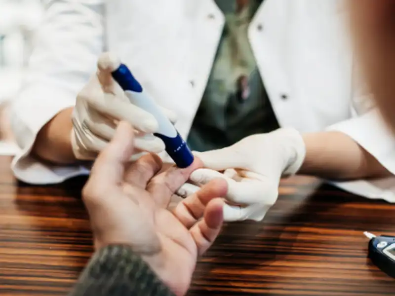 Finger prick from doctor.