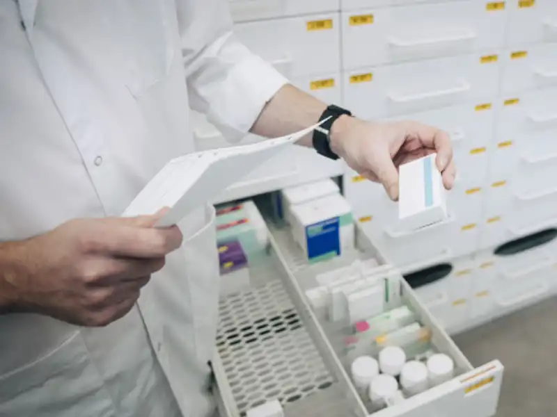 Pharmacist filling an order.